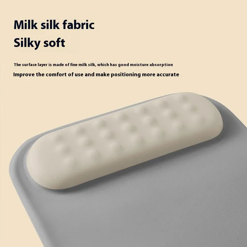Ergonomic cloth silicone mouse pad with raised wrist support in mint green colour.