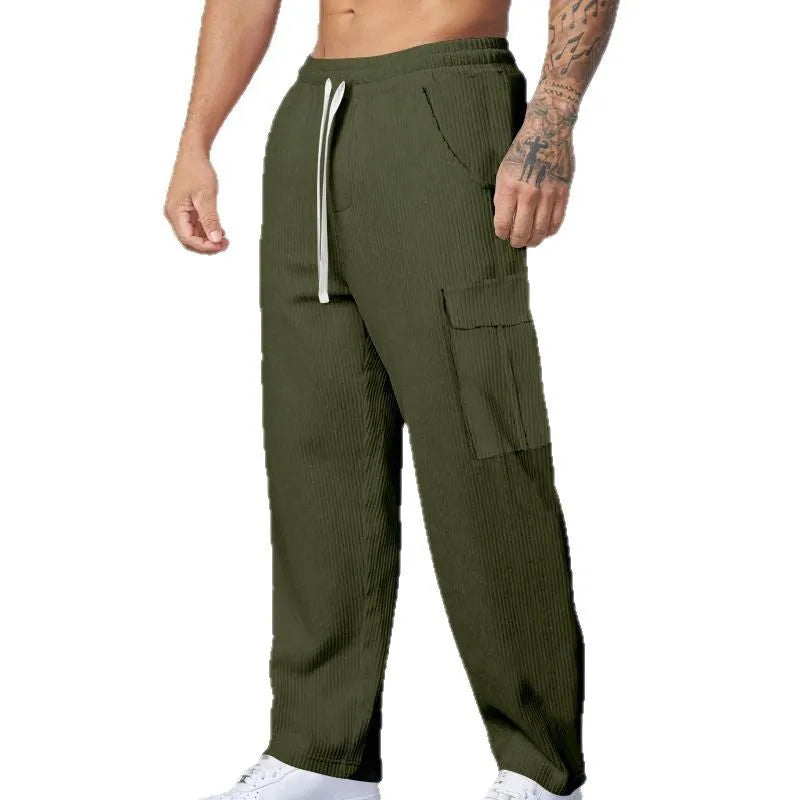 Men's loose-fitting corduroy cargo trousers in navy blue with straight wide-leg cut and elasticated waist