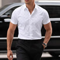 Light blue men's short-sleeved shirt with floral print, featuring a cardigan style and short sleeves.