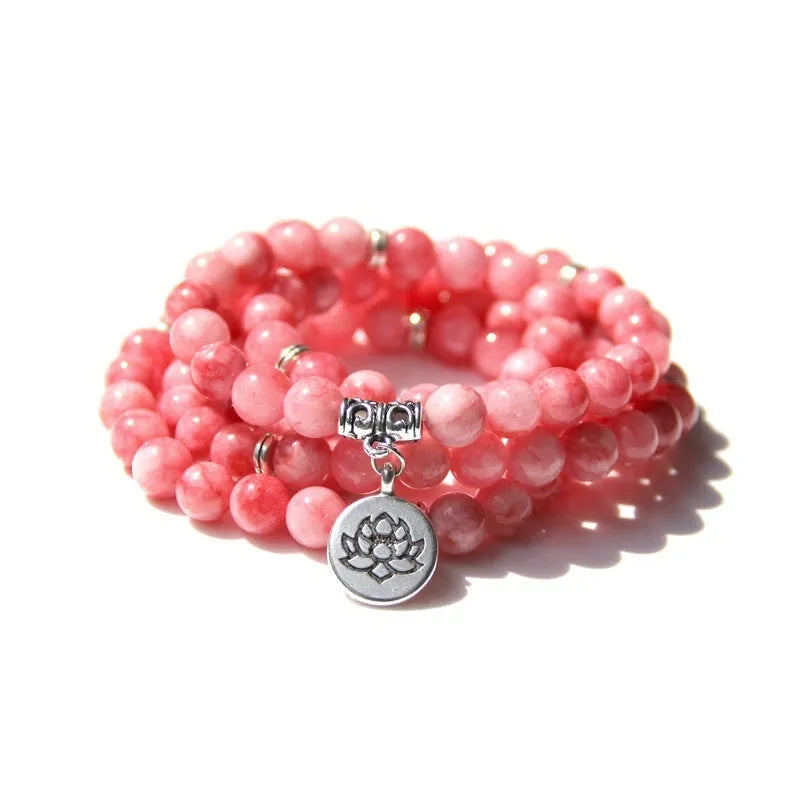Vintage natural stone bracelet for women with a geometric lotus pendant on a model's wrist.