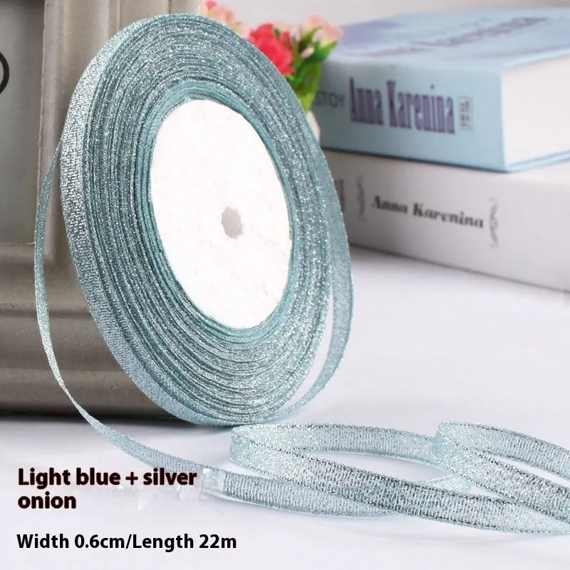 Roll of 0.6cm wide coloured polyester gift ribbon with 22 metre length.