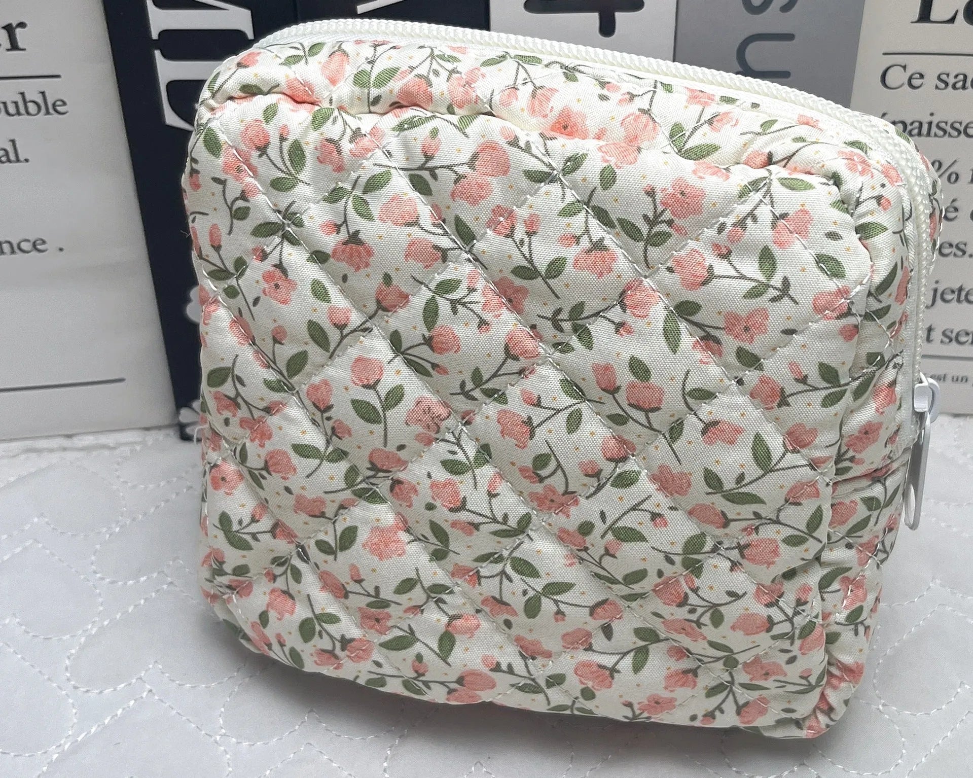 Women's floral patterned polyester key storage bag with sewing thread detail.