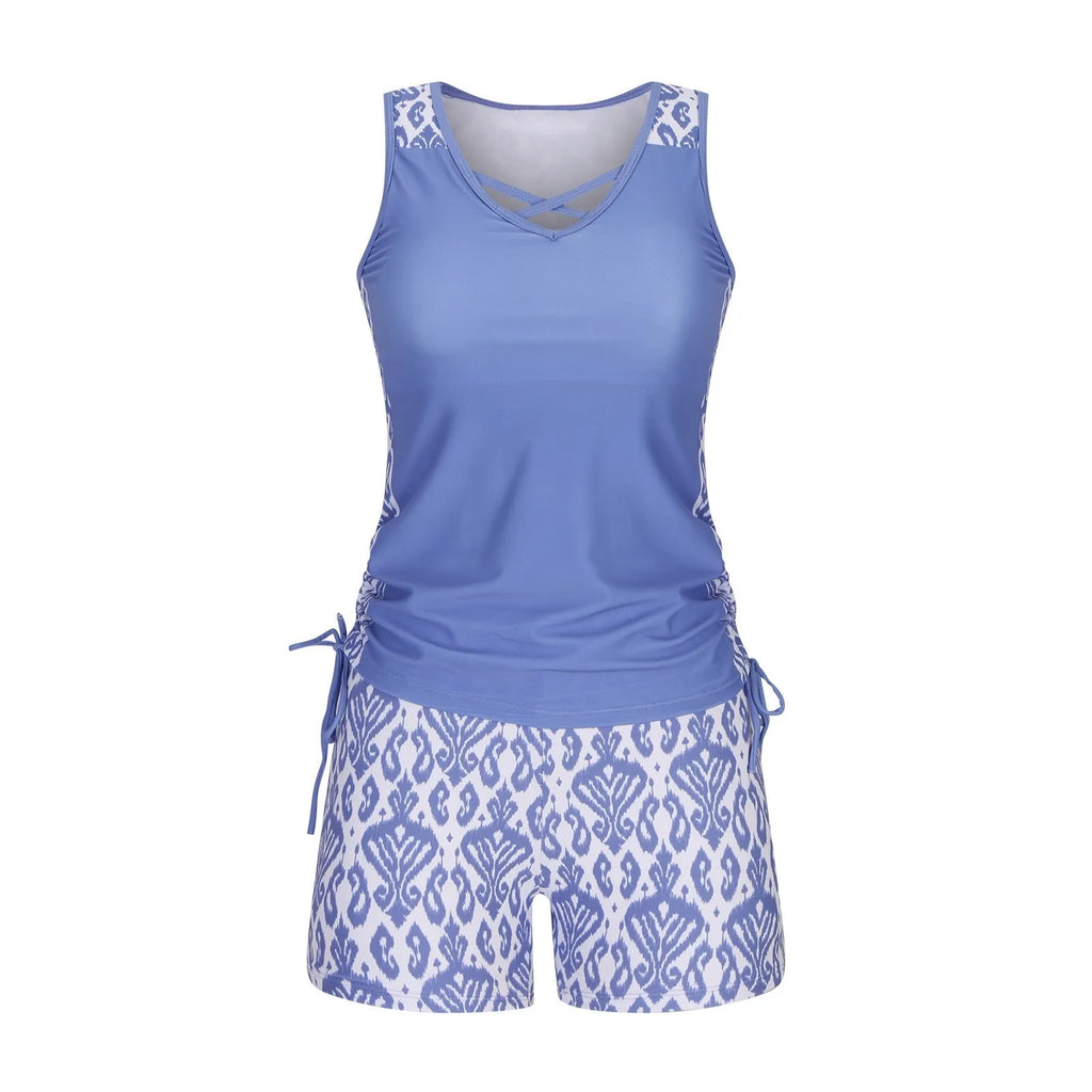 Women's blue printed lace two-piece swimsuit top and shorts laid flat.