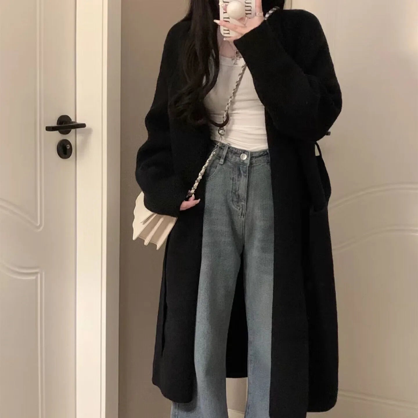 Women's loose knitted chenille cardigan in dark grey showing 3D pattern texture