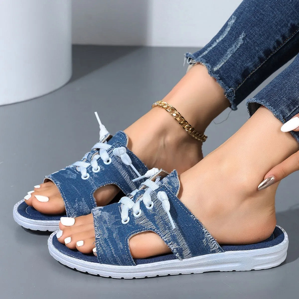 Blue Roman-style women's canvas slippers with rubber sole and cloth lining