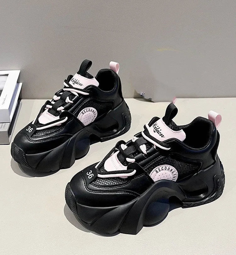 Women's beige casual sneakers with cross shoulder straps and a thick sole.