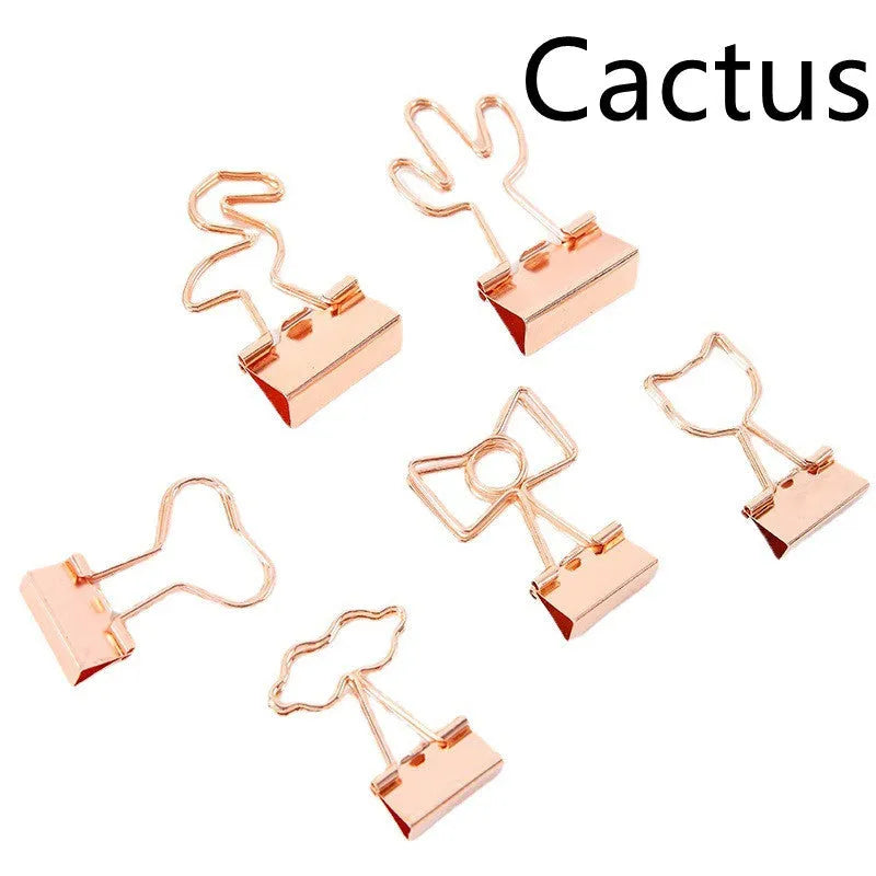 Gold-plated decorative binder clips showing flamingo, love, clouds, cat, cactus and bow designs