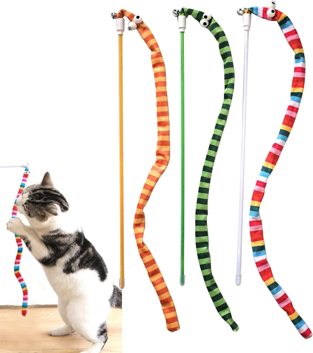 Colourful cat teaser wand with a long plush strip and a bell, held by a person.