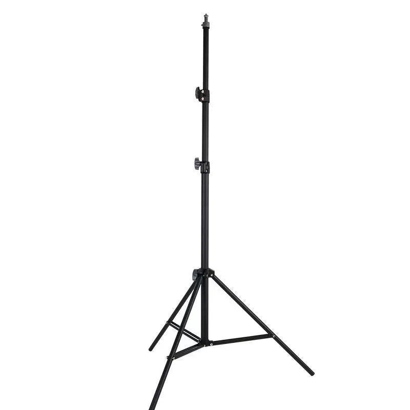 Frosted finish tripod light stand extended to full height with a mobile phone holder attached.