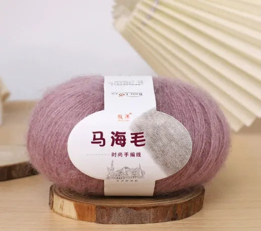 Mohair wool ball for DIY scarf knitting in assorted colours on white background