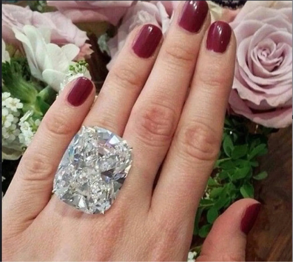 Simple inlaid square diamond ring in white gold colour on grey background