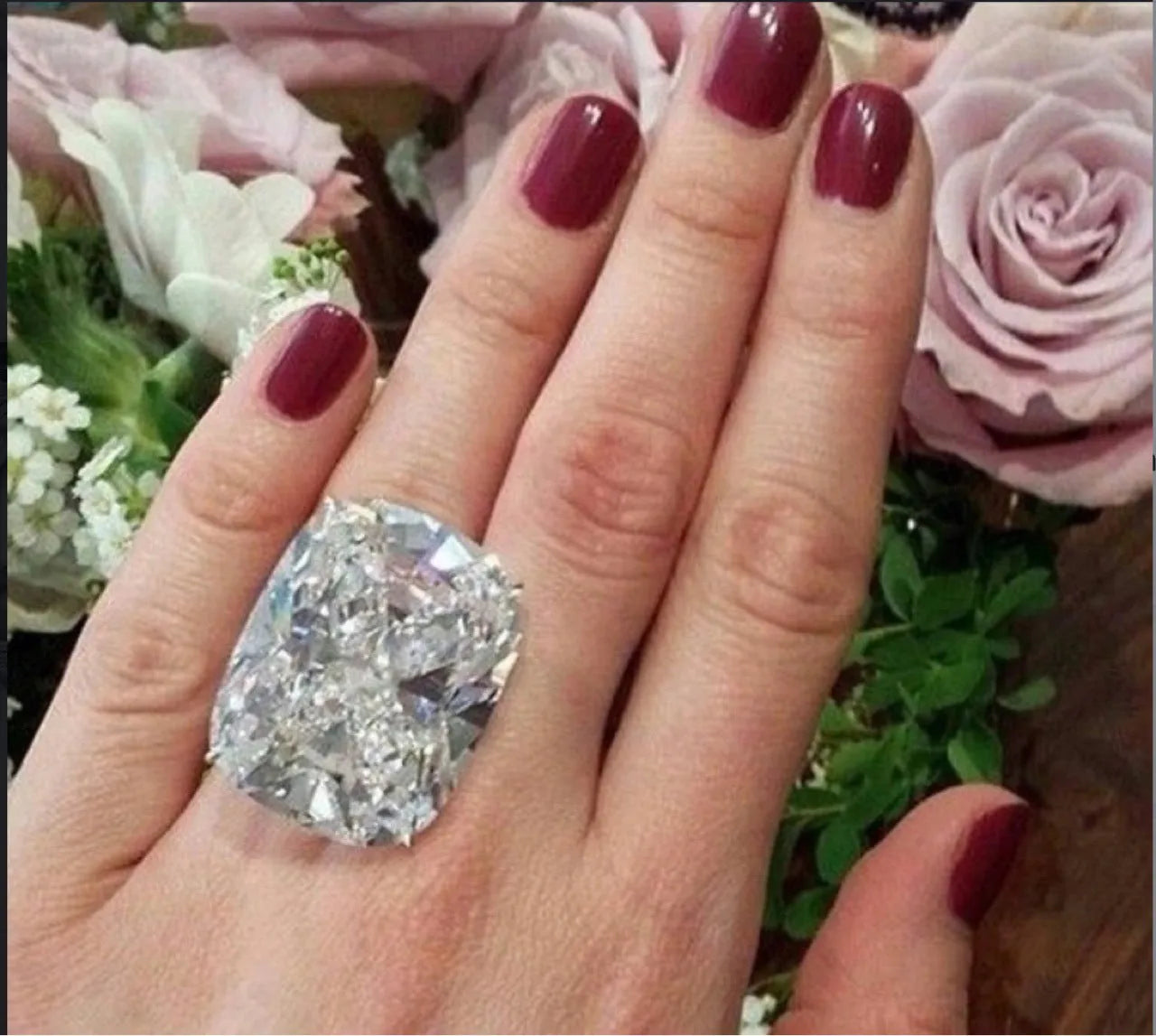Simple inlaid square diamond ring in white gold colour on grey background