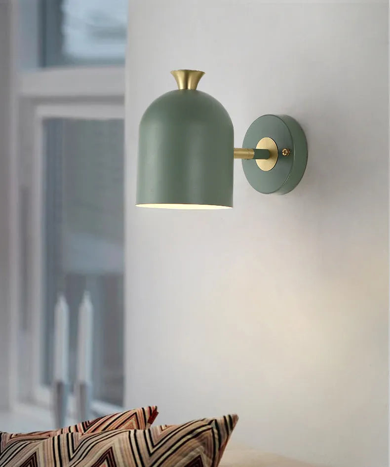 Circular aluminium bedside wall lamp with mirror front in choice of blue, green, pink or yellow finish