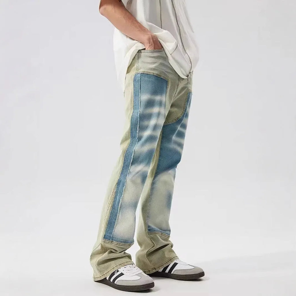 Yellow and blue retro patchwork jeans with splash-ink damaged design, mid-waist cut with zip fly