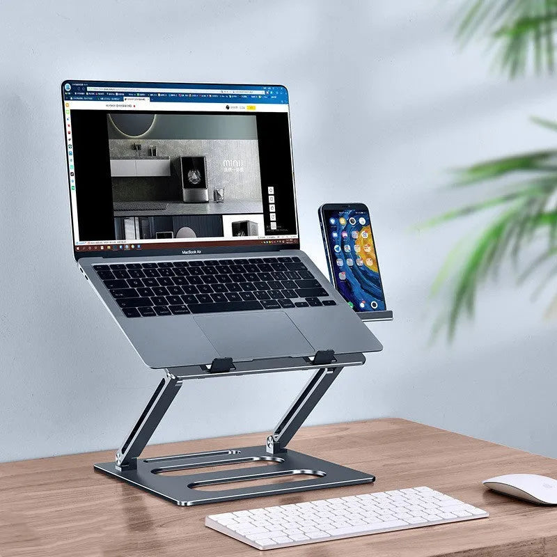 Silhouette of silver metal adjustable laptop stand on a desk with a clear 340mm elevation height and 260x248x35mm base dimensions