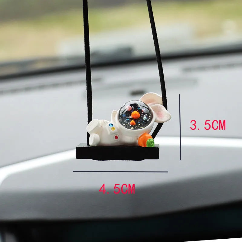 Resin cartoon astronaut car pendant available in red flag, telescope, and radish holding styles for dashboard decoration.