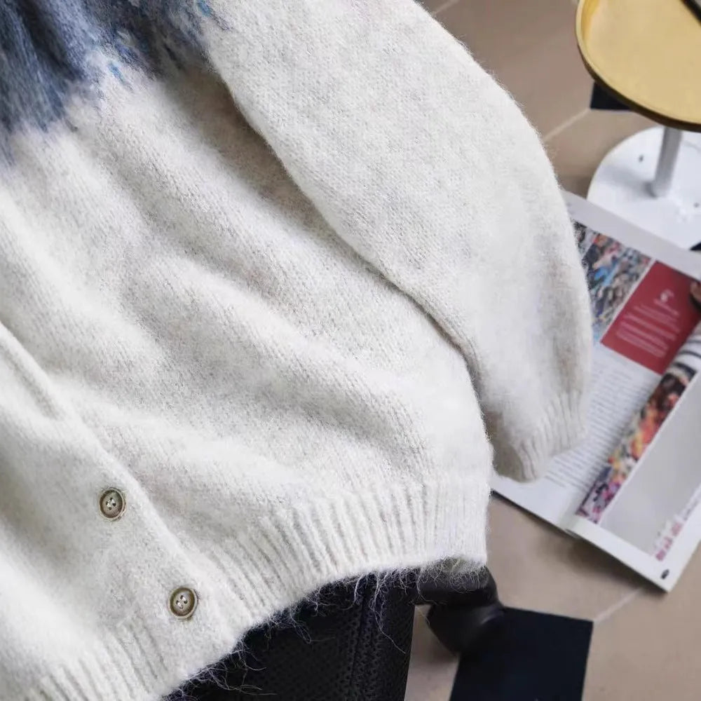 Women's thick jacquard knit sweater coat in a loose fit, shown in milky white colour with long sleeves.