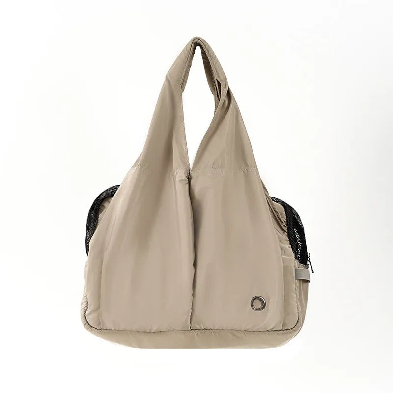 Apricot pet carrier bag with adjustable shoulder strap and side ventilation panels