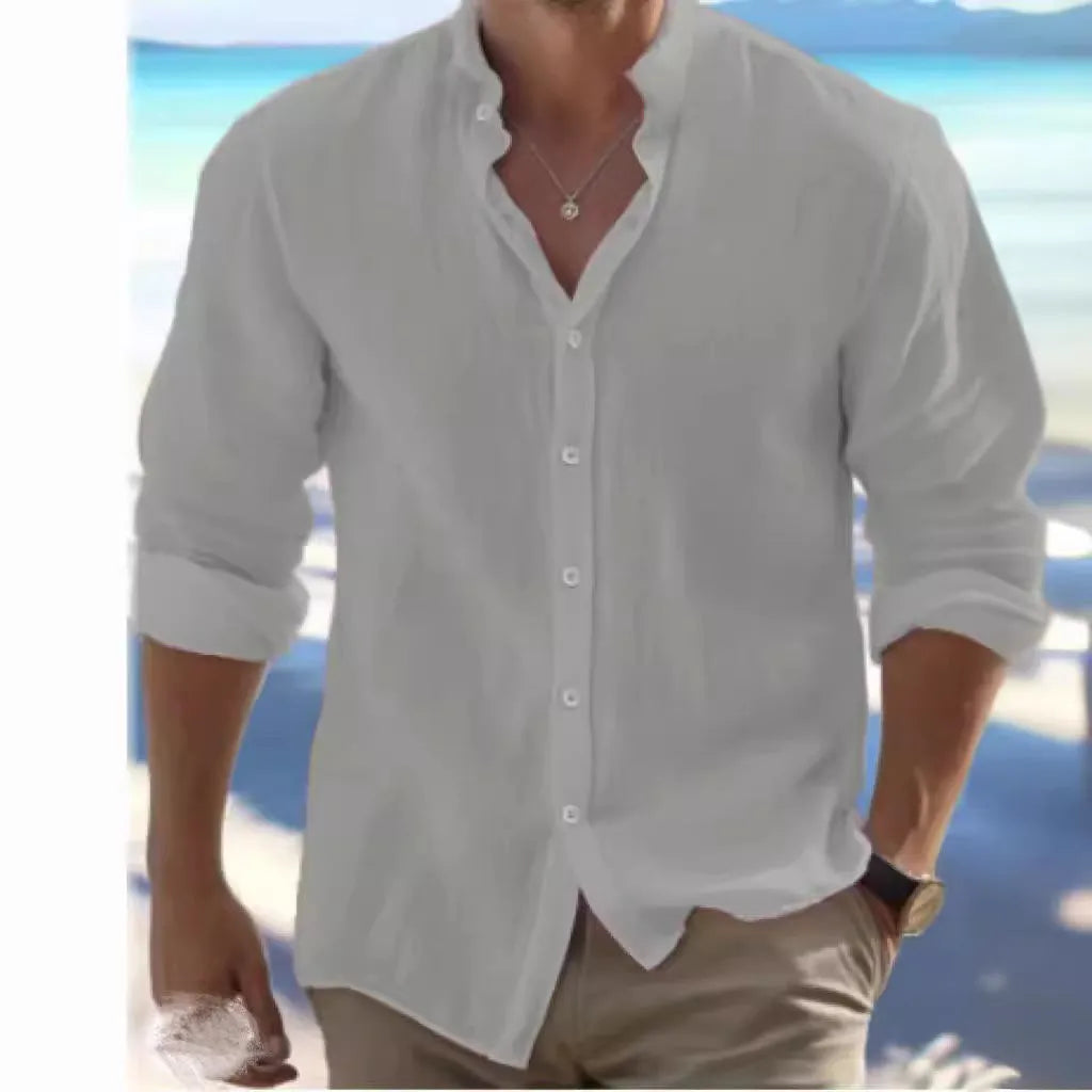 Men's long-staple cotton pullover shirt in light blue with collage stitching detail, laid flat.