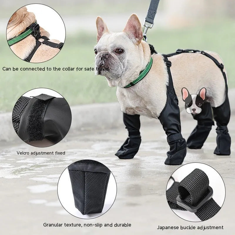 Black waterproof dog shoes with adjustable buckle and non-slip sole on surface