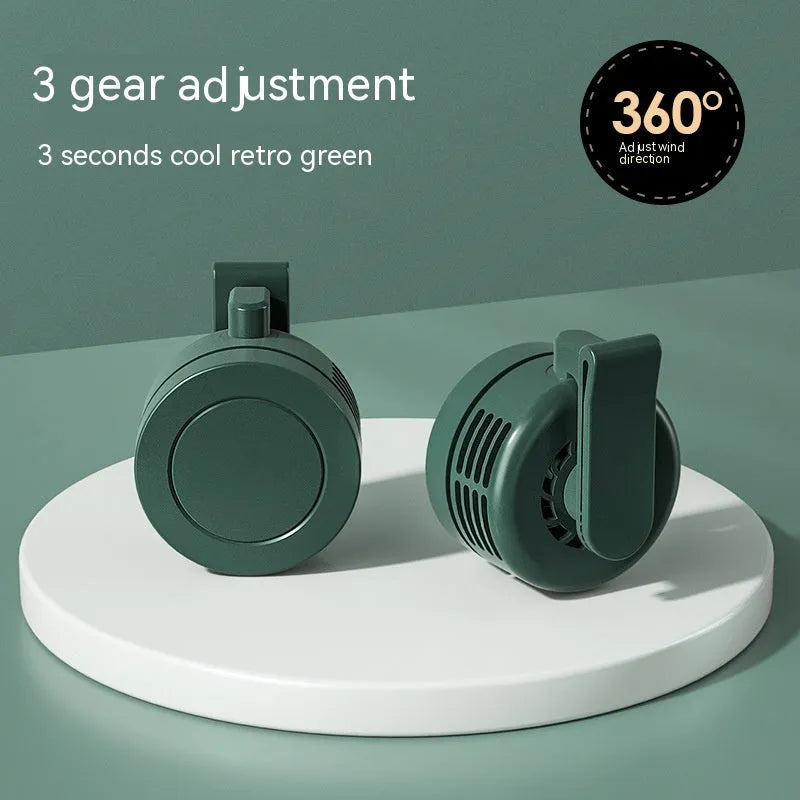 Green wrist hanging personal fan with light and USB charging port, shown with silicone neck strap.