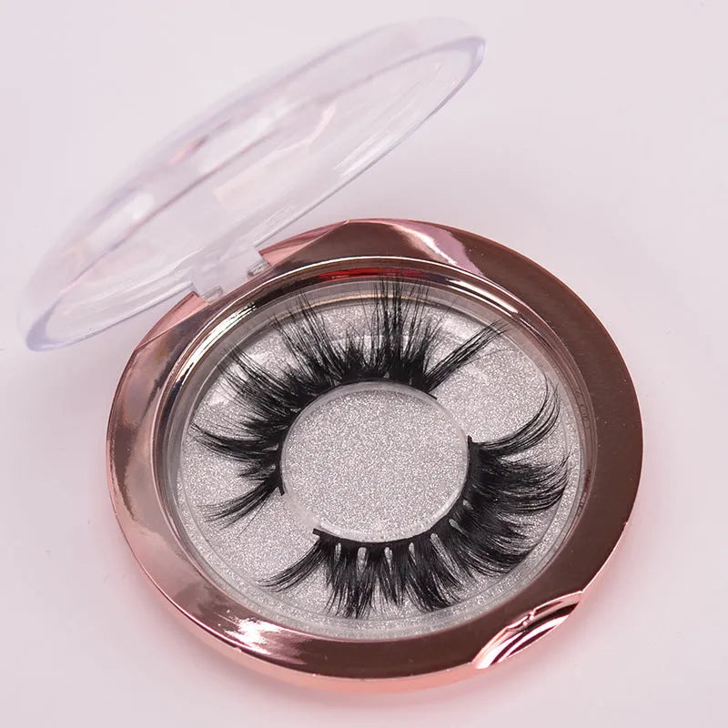 Handmade 5D volume false eyelashes made from mink hair with a storage case and application brush.