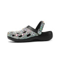 Black women's platform sandals with rhinestone decoration and hole shoes design on an EVA sole.