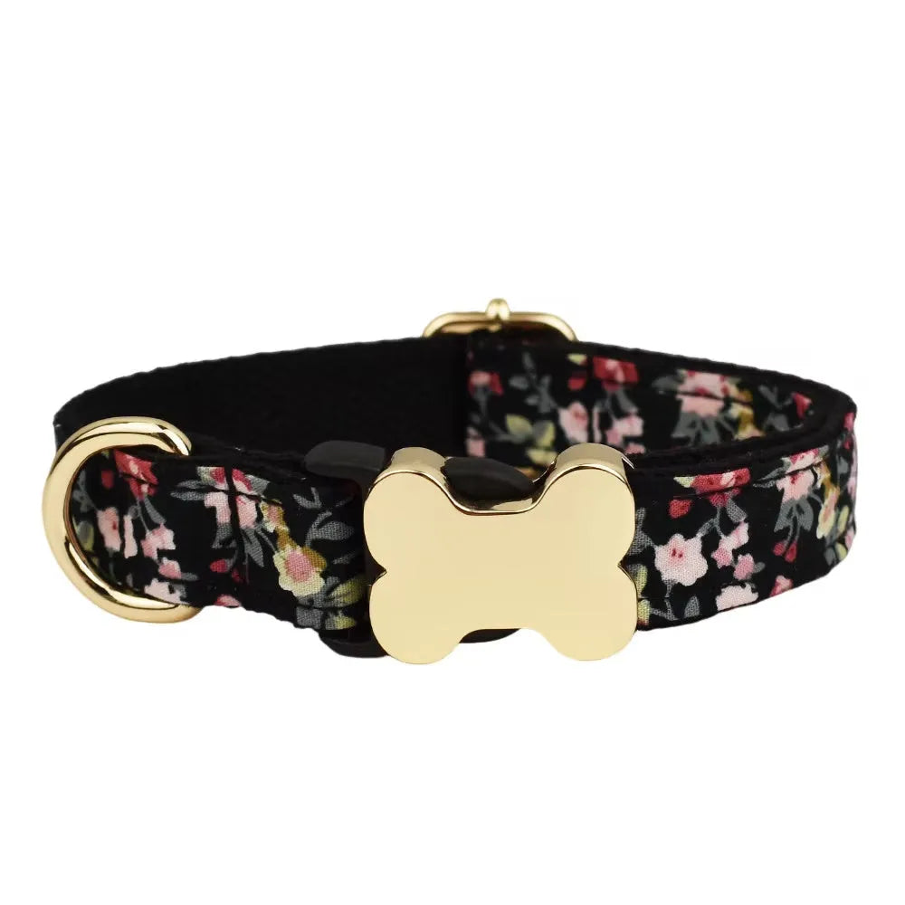 Flat nylon dog collar with a printed grid pattern and a silver bone-shaped metal buckle on a white background.