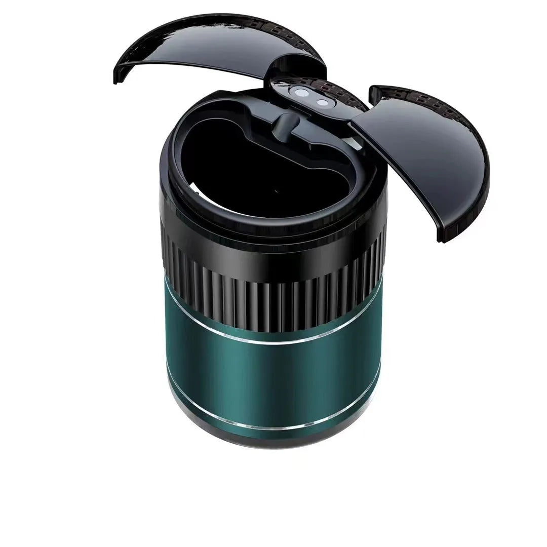 Black automatic infrared sensing metal car ashtray with lid on a car dashboard.