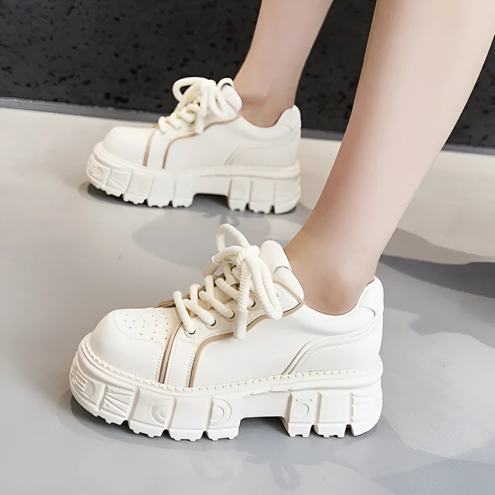 Women's beige leather muffin bottom casual slip-on shoes with a rubber foam sole.