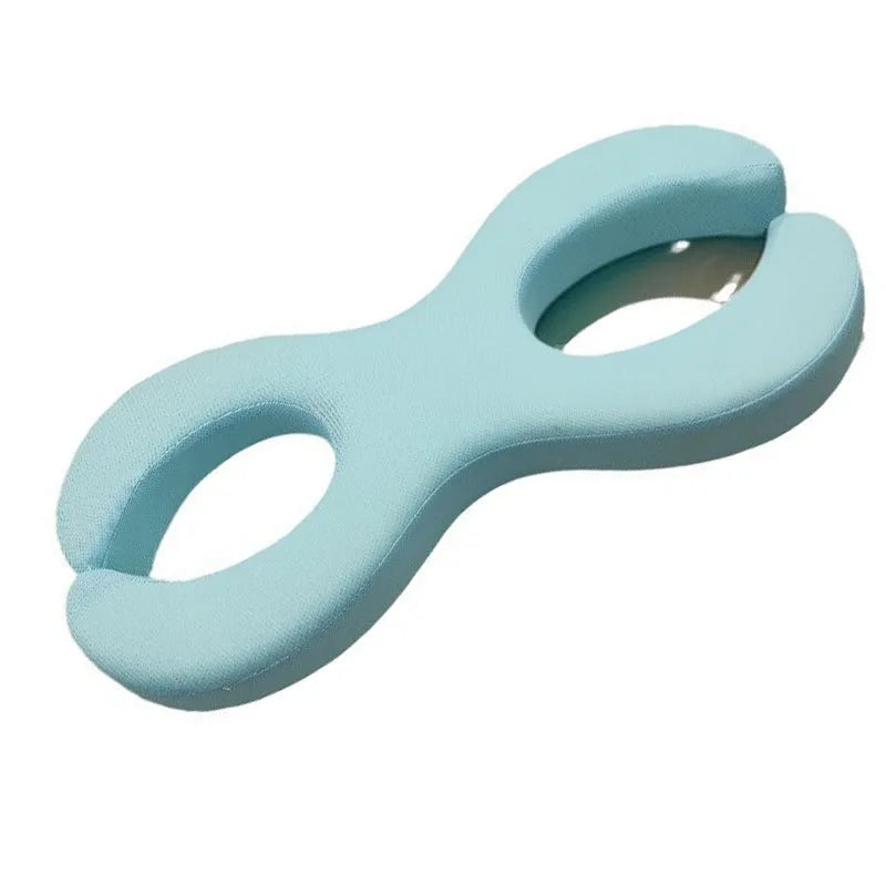 Cylindrical blue memory foam cervical traction pillow showing 6cm and 9cm thickness options