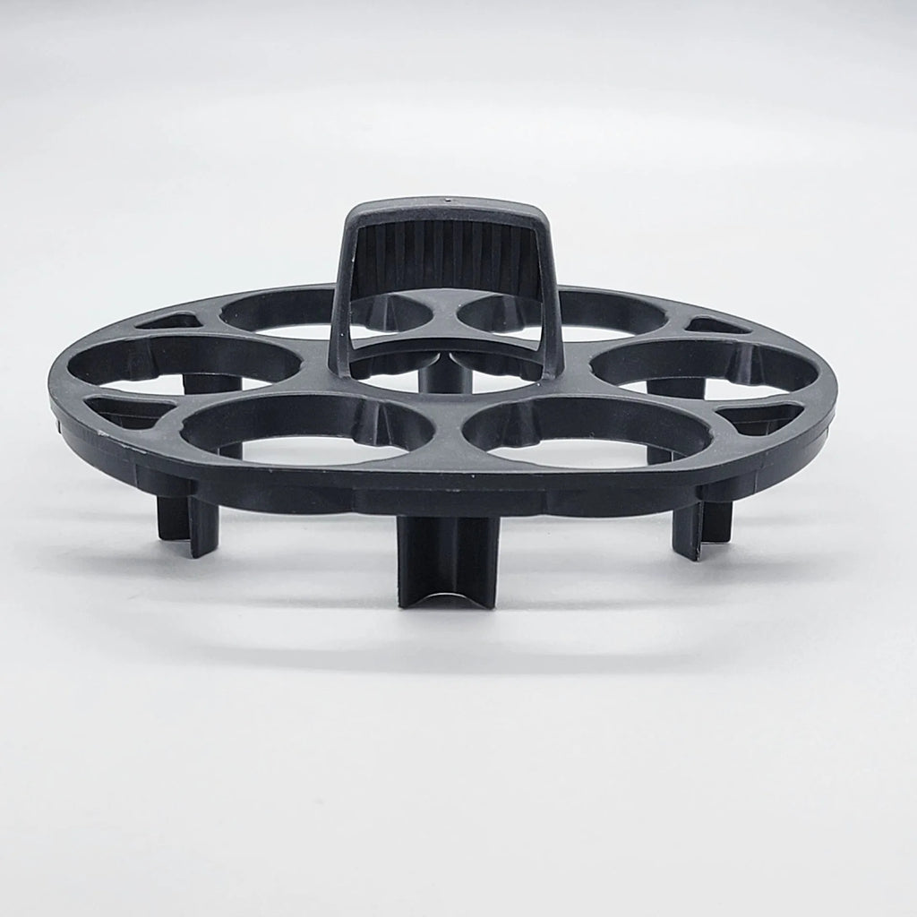 Black plastic egg holder basket for kitchen countertop storage.