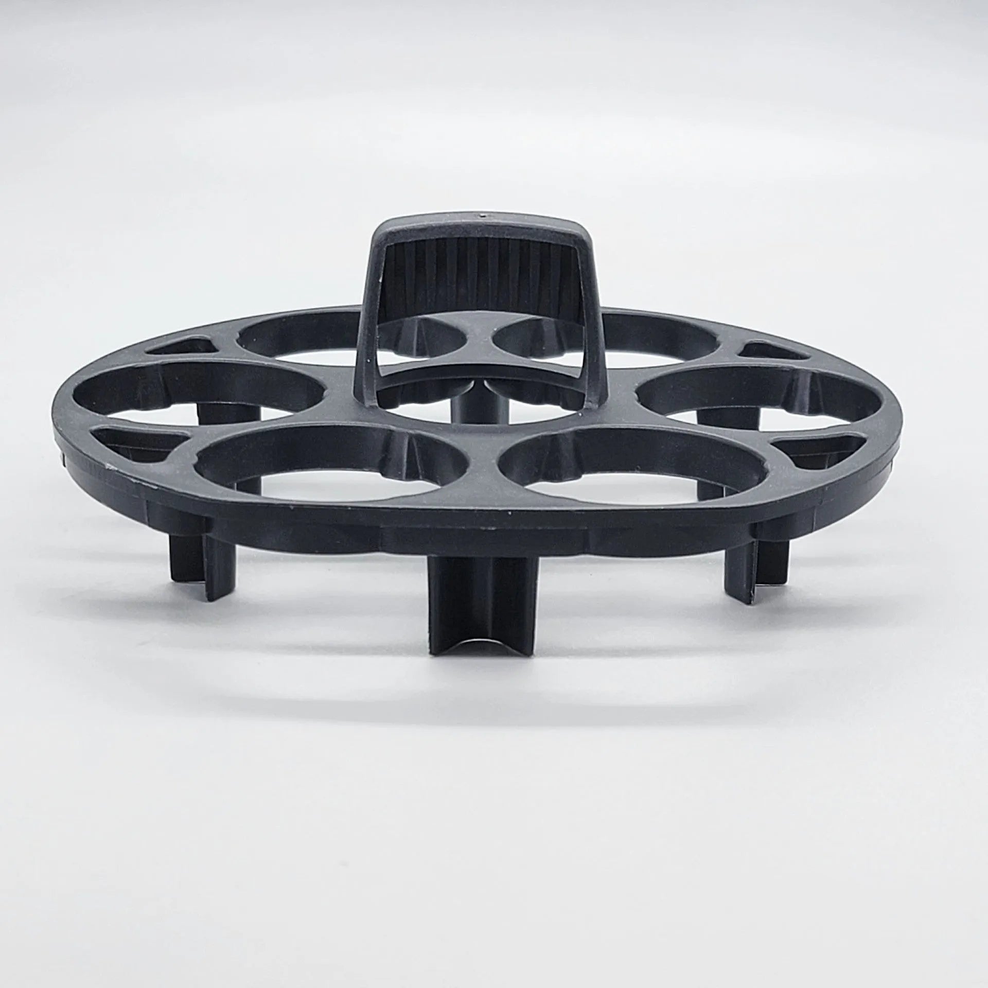 Black plastic egg holder basket for kitchen countertop storage.