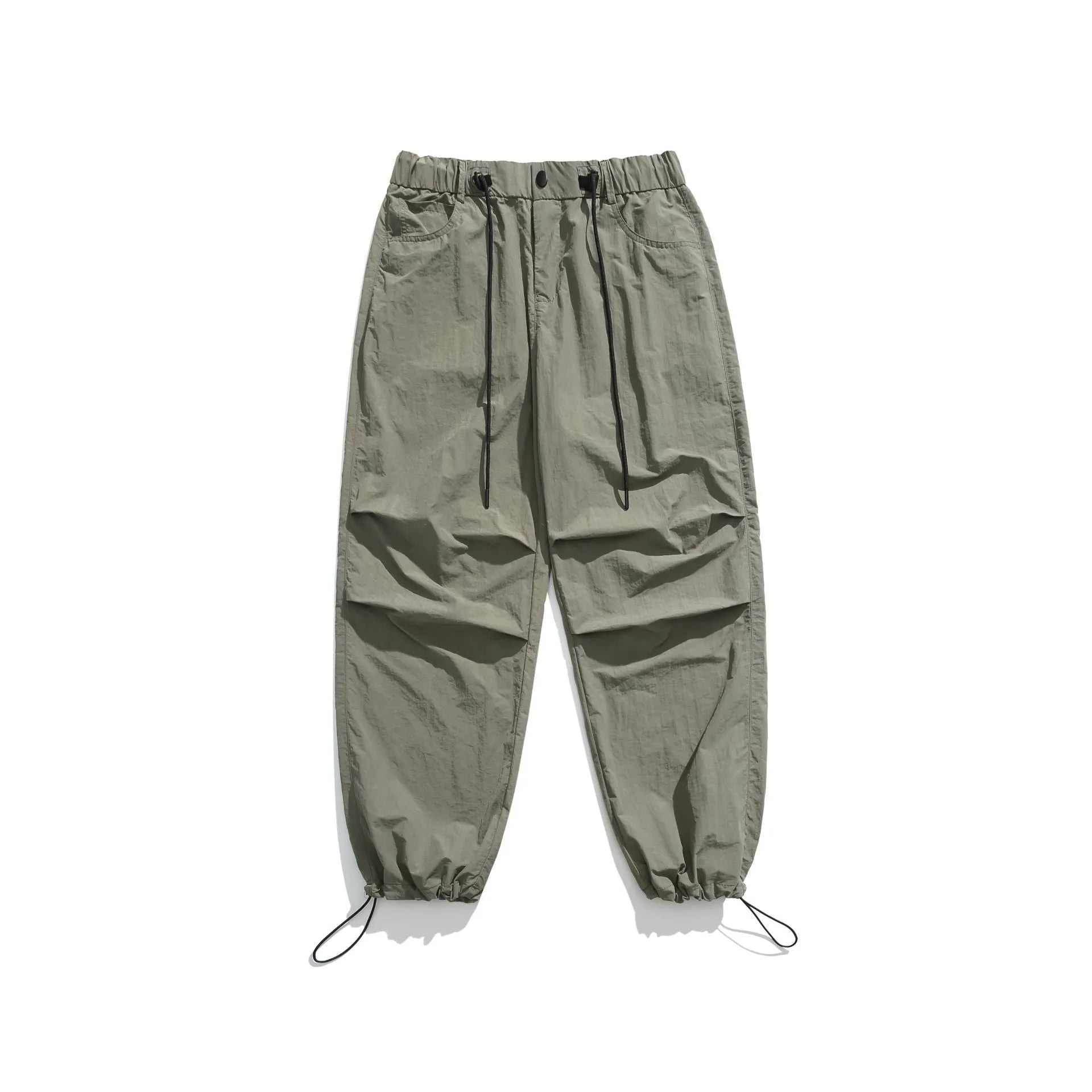 Man wearing loose straight-leg casual trousers in thin ice silk nylon fabric, showing apricot colour option.