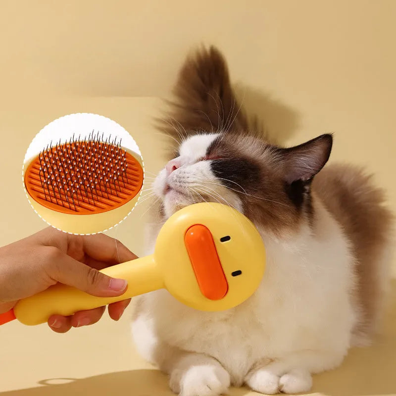 Small yellow duck-shaped pet comb with needle bristles for grooming cats and dogs