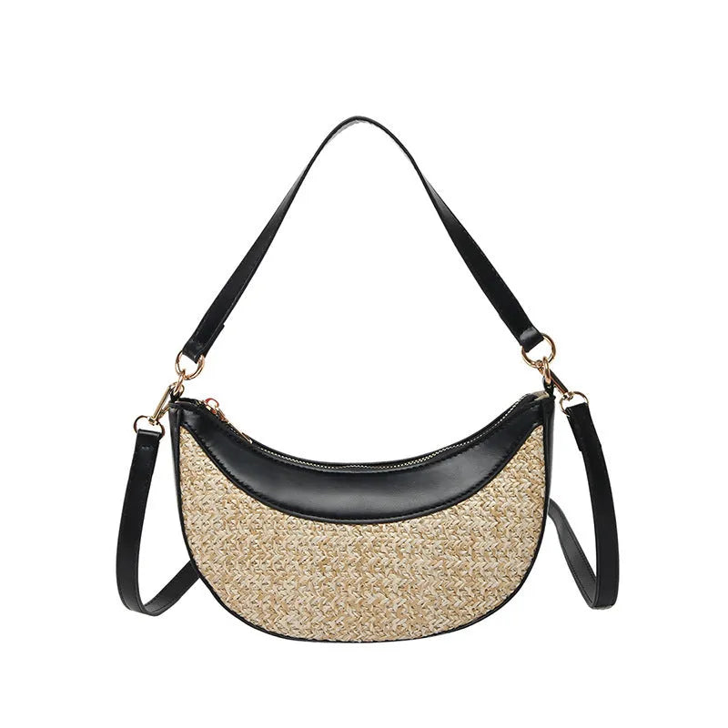Hard structured straw dumpling shaped women's crossbody shoulder bag in black with contrast stitching.