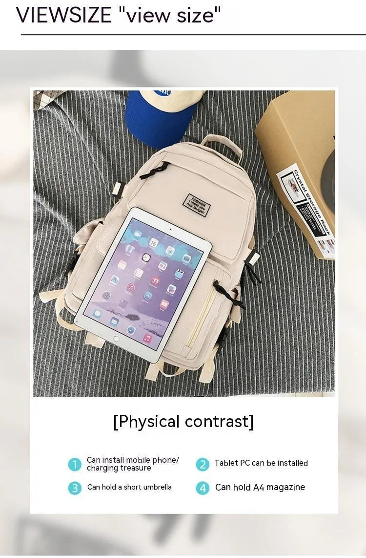 Black and white student backpack with computer compartment showing dimensions 31x12x41cm