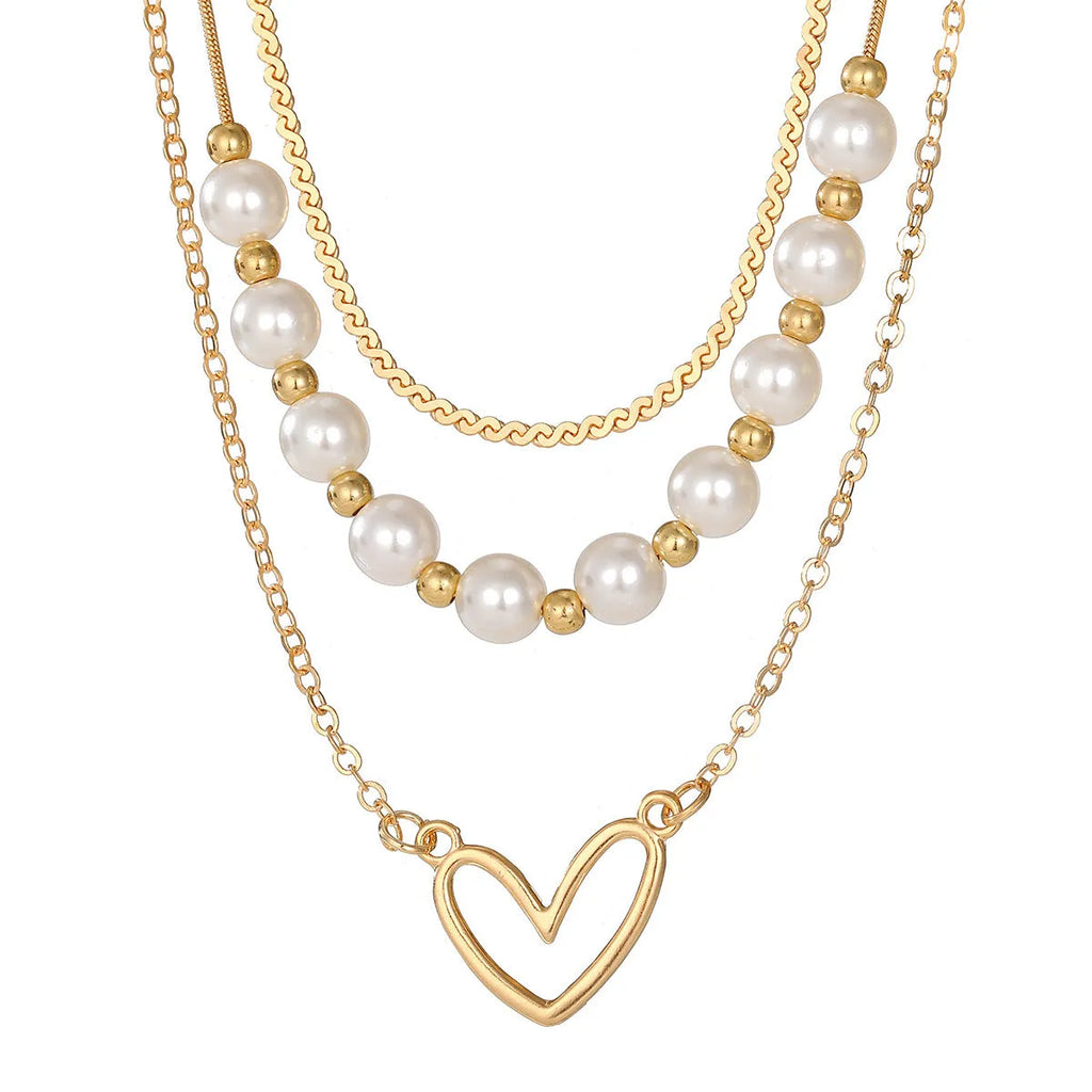 Vintage gold necklace with heart pendant on pearl-style chain, adjustable 41-50cm length