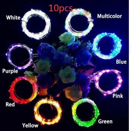 Copper wire LED string light with 20 bulbs and a white plastic bottle stopper for decoration.