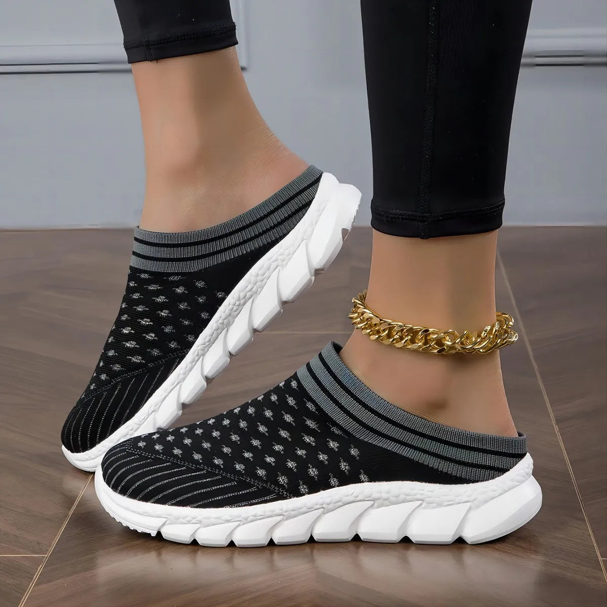Women's black striped Flyknit socks semi slipper shoes with hollowed-out design and viscose sole.