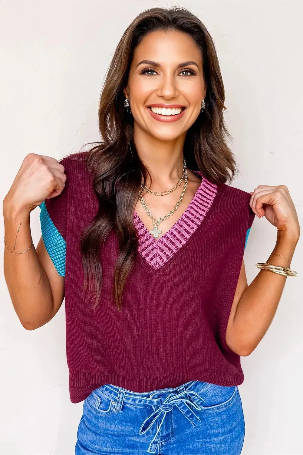 Burgundy women's loose sweater with V-neck, contrast trim, and cuffed short sleeves