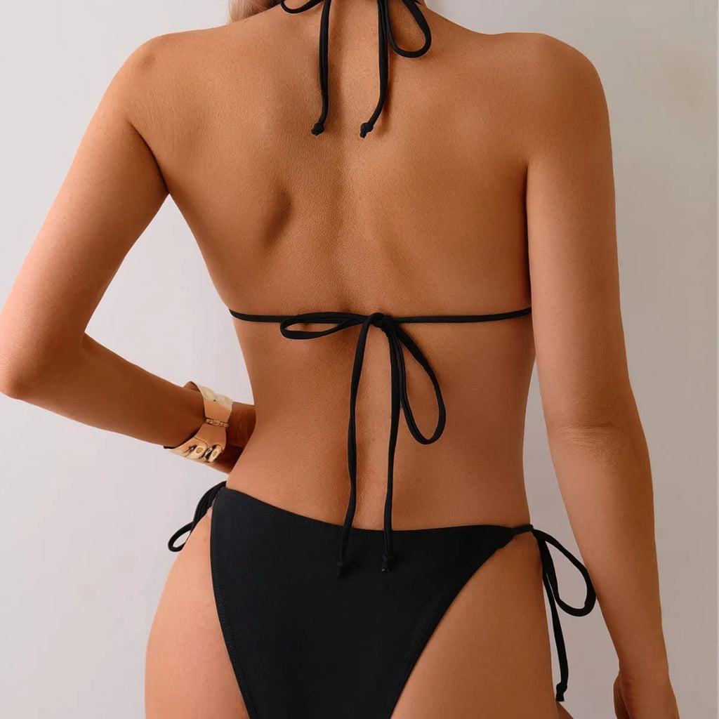Black women's bikini swimsuit with metal bead split detail on a mannequin