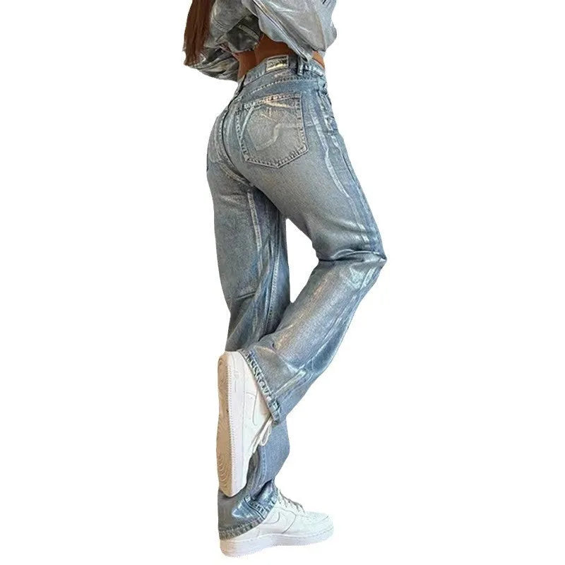 Women's washed blue high waist straight leg jeans with silver contrast details on back pockets