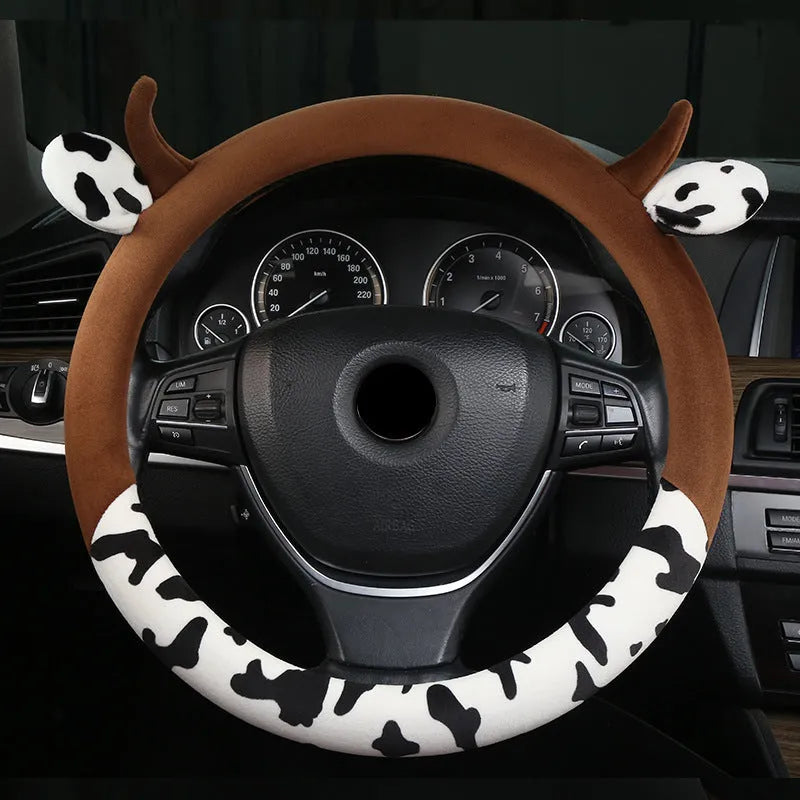 Short plush car steering wheel cover with protective handle in black colour showing 38cm diameter measurement