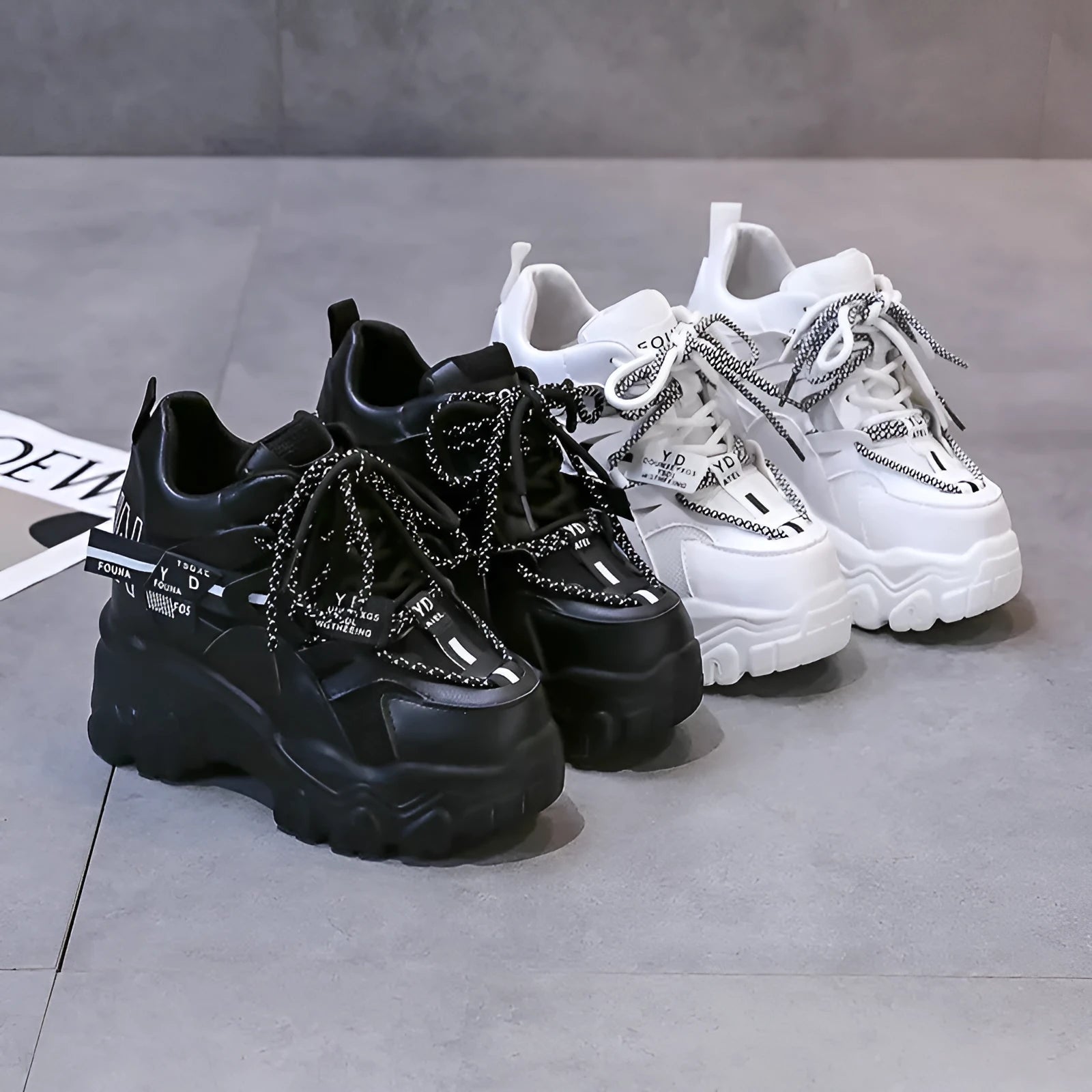 White women's low-top platform sports shoes with breathable mesh, cross strap, and rubber sole.