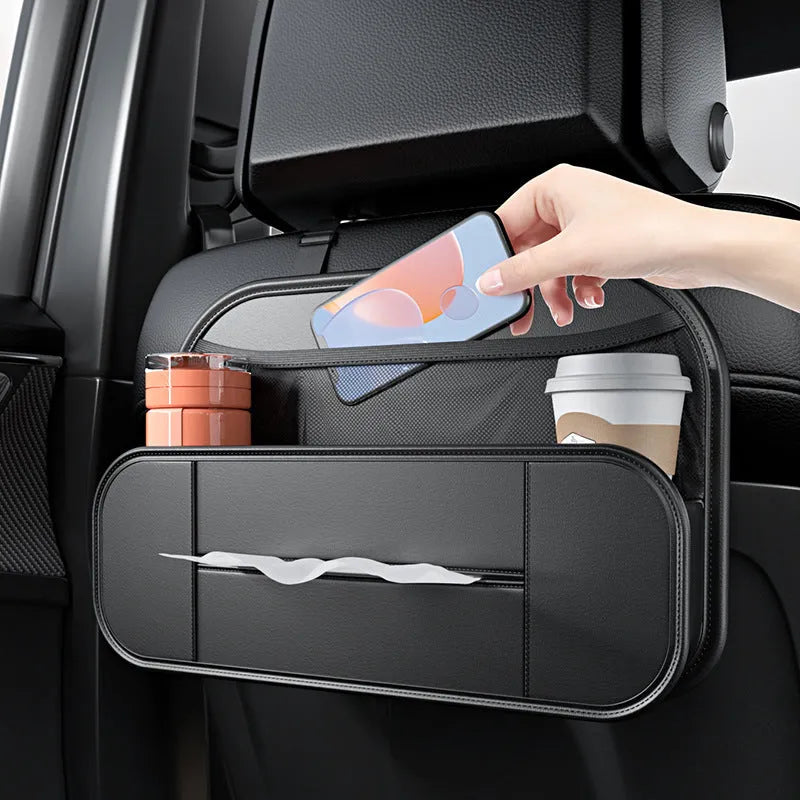 Black leather car seat back storage bag with adjustable straps measuring 36cm wide by 24cm high