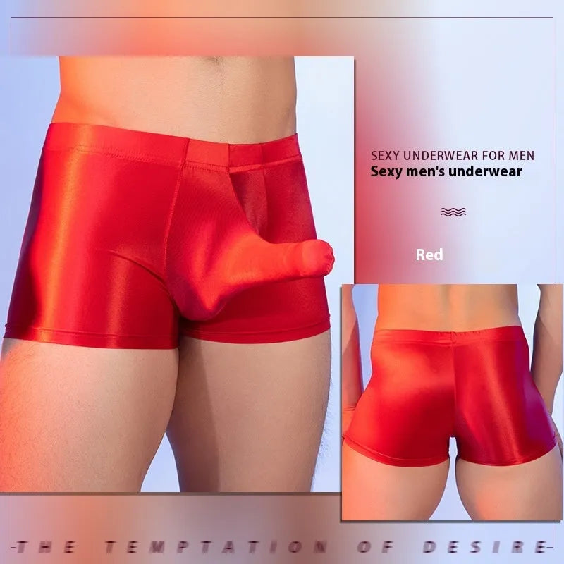 Men's red boxer shorts with an elephant nose pattern, showing mid-waist and seamless design.