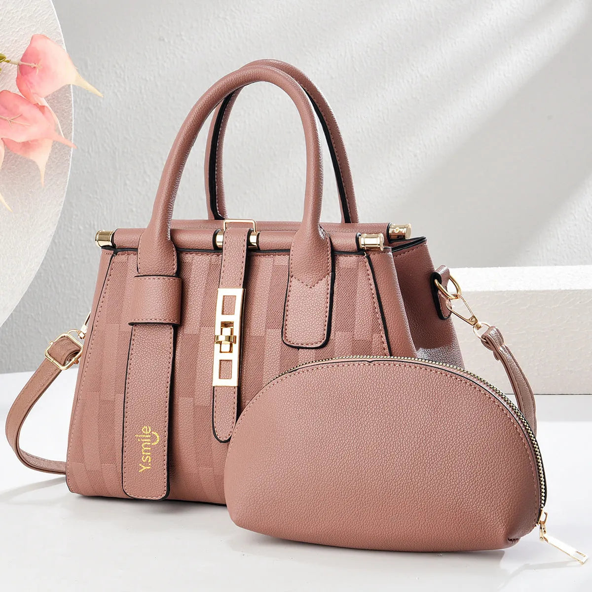 Round PU leather crossbody handbag in light khaki colour showing front view and adjustable shoulder strap.