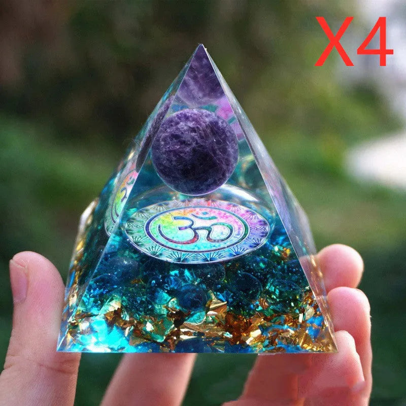 Clear epoxy resin pyramid ornament with embedded coloured crystal gravel inside, measuring 6cm.
