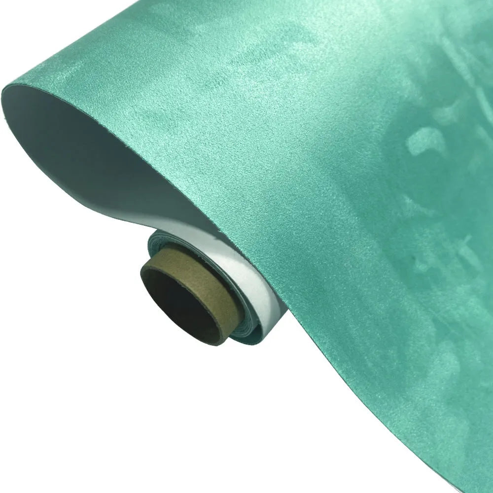 A sheet of self-adhesive black leather suede material with a ruler showing its 0.5mm thickness.